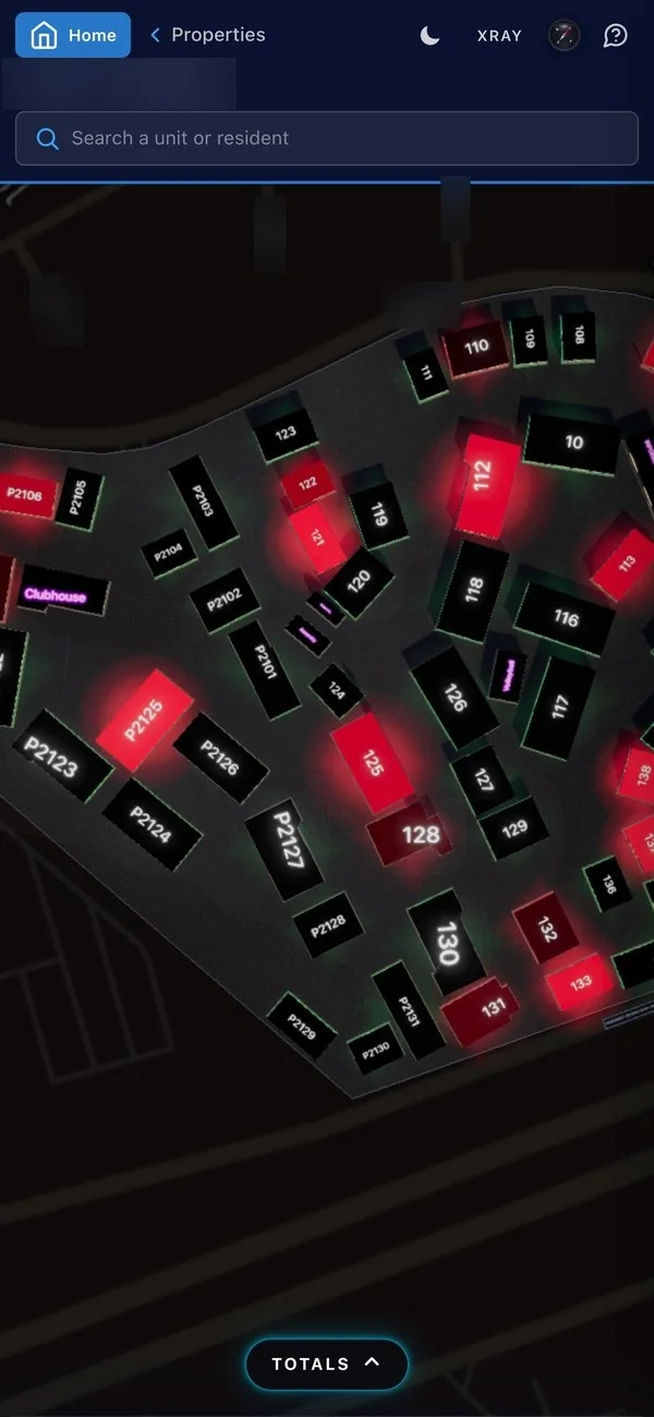 BlueTopaz on a phone: the 3D map of one property, every building drawn; the property name blurred